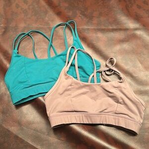 Two good used condition born primitive lotus sports bras. Size small.